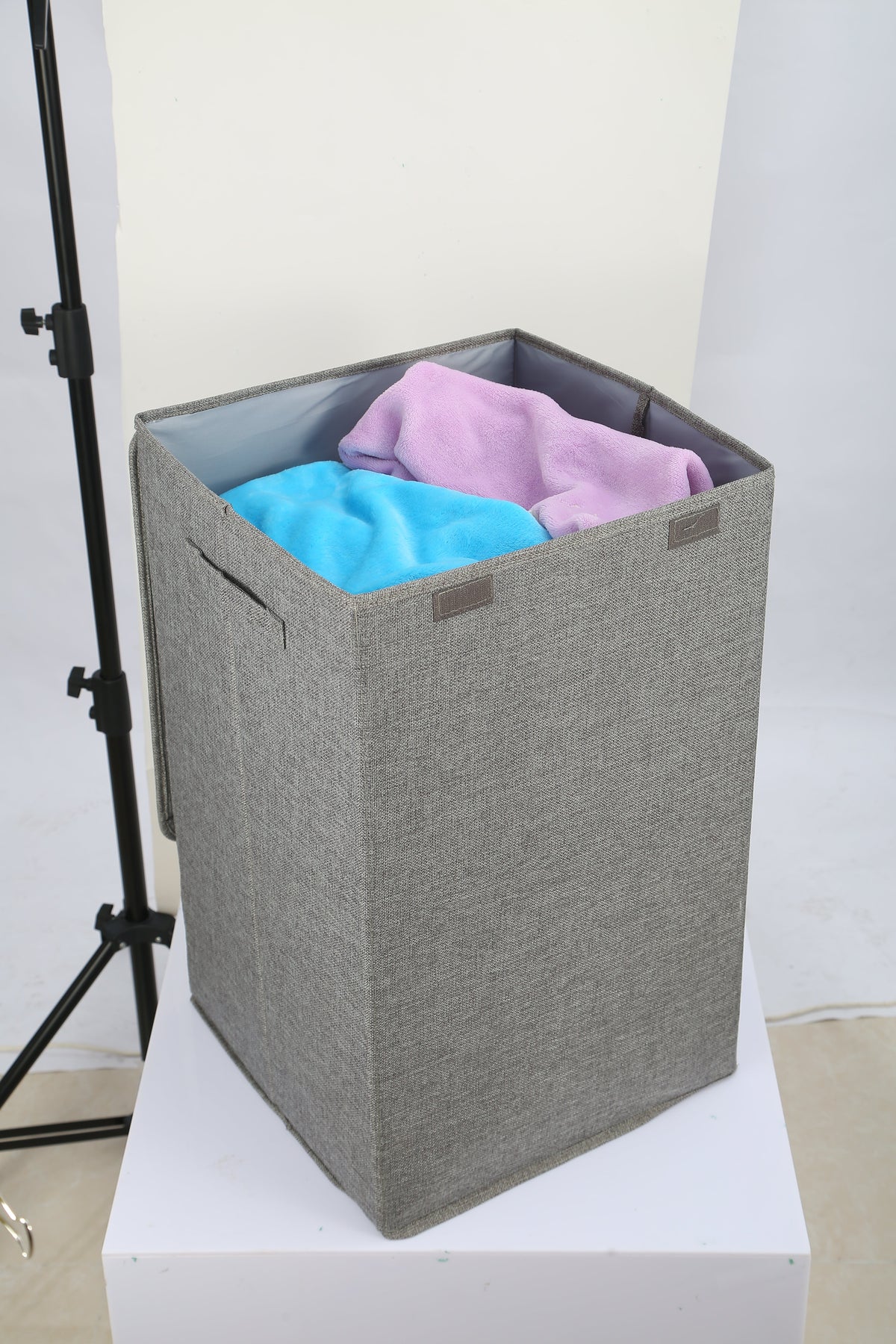 Gray linen-look hamper with lid open