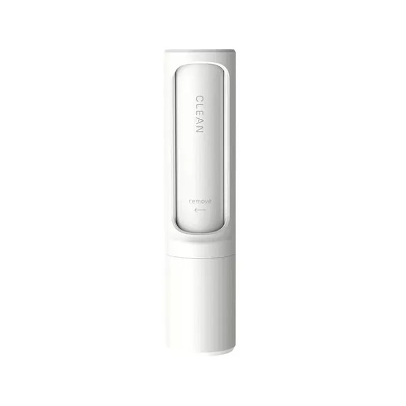 Self-cleaning lint brush removing pet hair